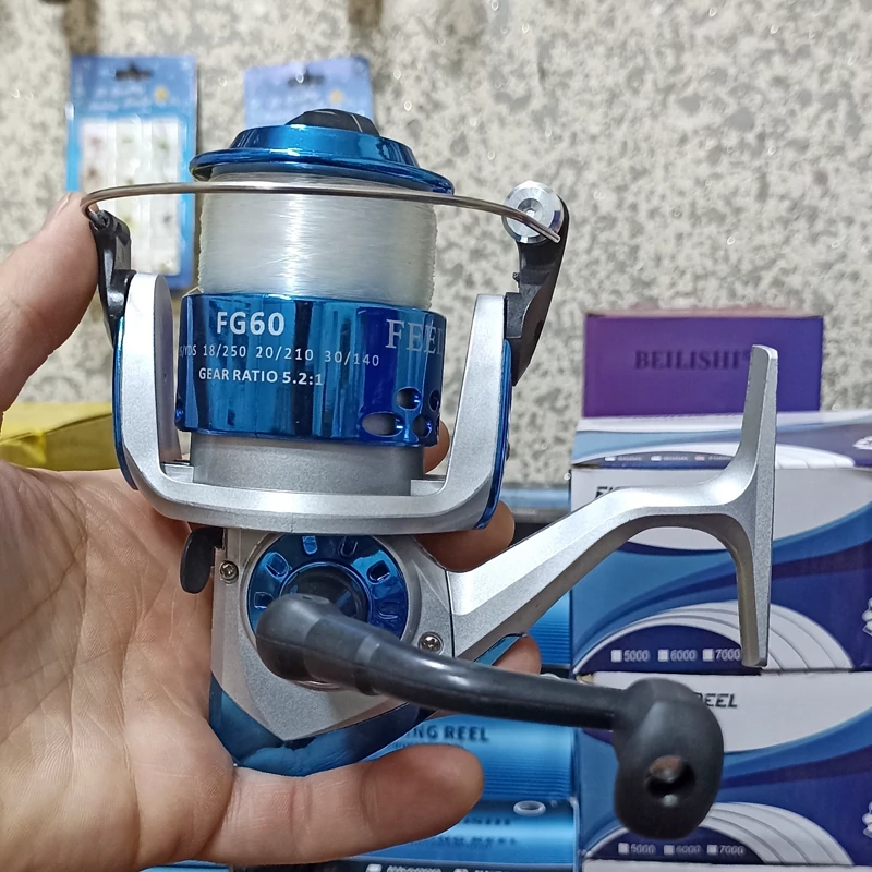 چرخ ماهیگیری 7000 برند دیوزن به همراه نخ مدل FG60 مناسب برای چوب ماهیگیری لنسر ماهیگیری