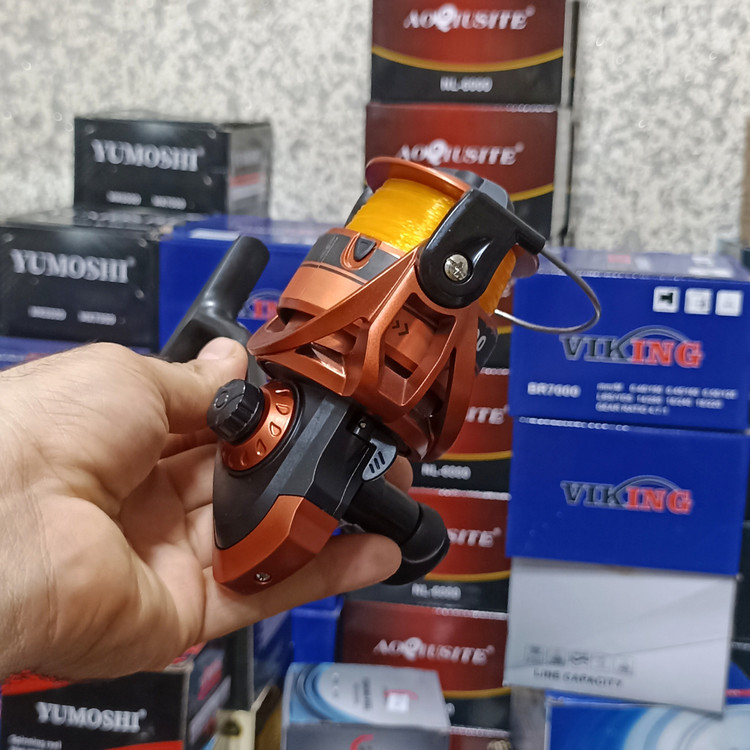 چرخ ماهیگیری 7000 برند پودریک به همراه نخ مدل CC7000 مناسب برای چوب ماهیگیری لنسر ماهیگیری